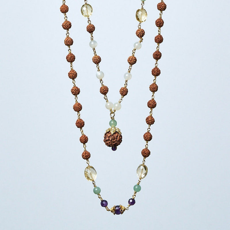 Lakshmi Puja mala is a truly elegant combination of rudraksha, amethyst, jade, citrine, pearls, and moonstones, with a 7-Mukhi Power Rudraksha as pendant bead, strung on 22k gold vermeil wire